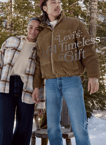 A Man In A Levi 'S Timeless Gift Jacket Stands Next To A Woman In A Plaid Shirt GIF