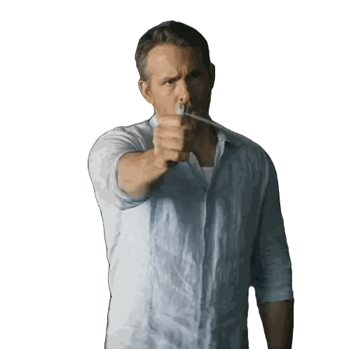 a man in a light blue shirt is pointing a knife at the camera