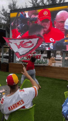 A Man In A Mahomes Jersey Watches A Game GIF