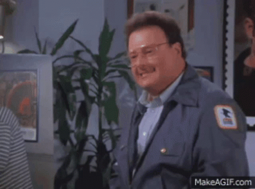 A Man In A Mailman 'S Uniform Has A Us Postal Service Patch On His Chest GIF