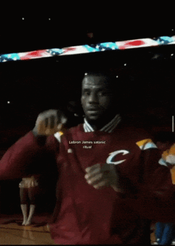 A Man In A Maroon Jacket With The Letter C On His Chest GIF