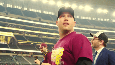 A Man In A Maroon Shirt With A Yellow Simpson On It GIF
