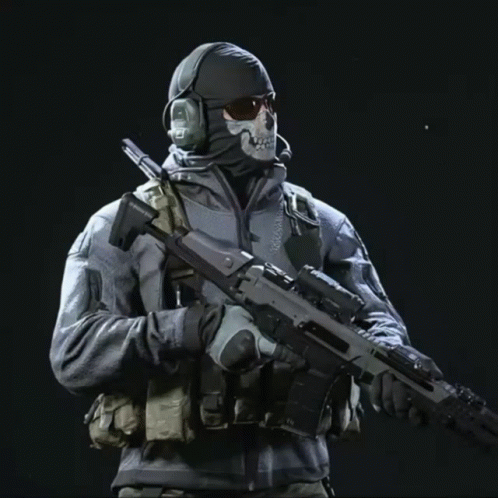 A Man In A Mask Holds A Rifle With The Word Mission On The Side GIF