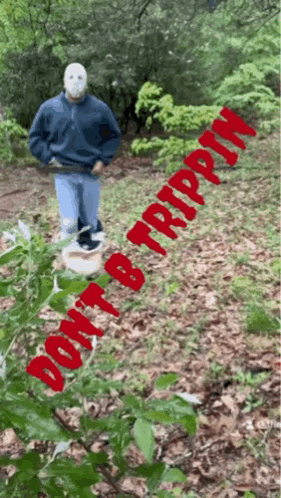 A Man In A Mask Is Standing In The Woods With The Words " Do N't B Trippin " Written In Red GIF