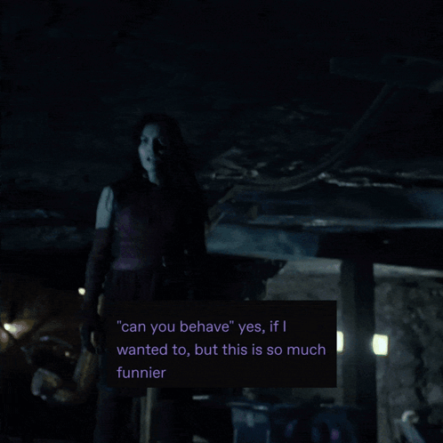 A Man In A Mask Stands In A Dark Room With A Green Light Behind Him GIF