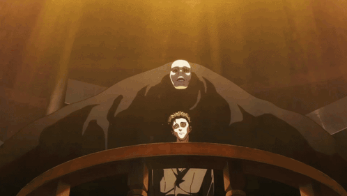 A Man In A Mask Stands In Front Of A Large Monster GIF