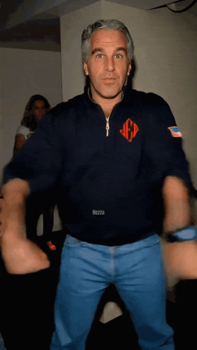 A Man In A Mezza Sweatshirt Is Dancing In A Room GIF