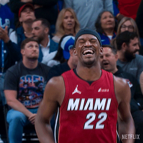 A Man In A Miami 22 Jersey Is Laughing GIF