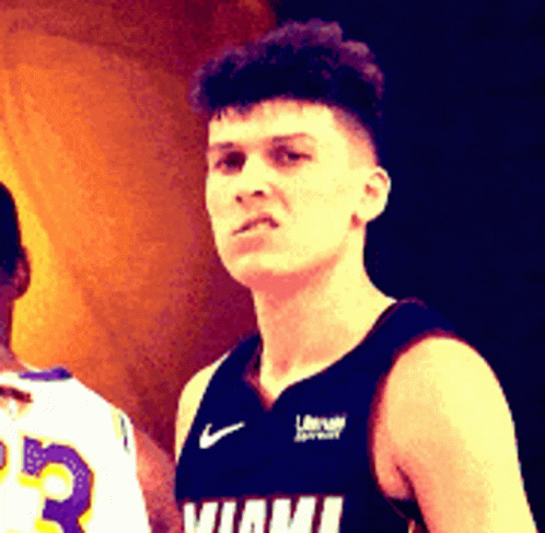 A Man In A Miami Jersey Stands Next To Another Player GIF