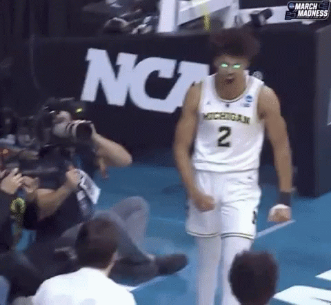 A Man In A Michigan Jersey With The Number 2 On His Chest GIF