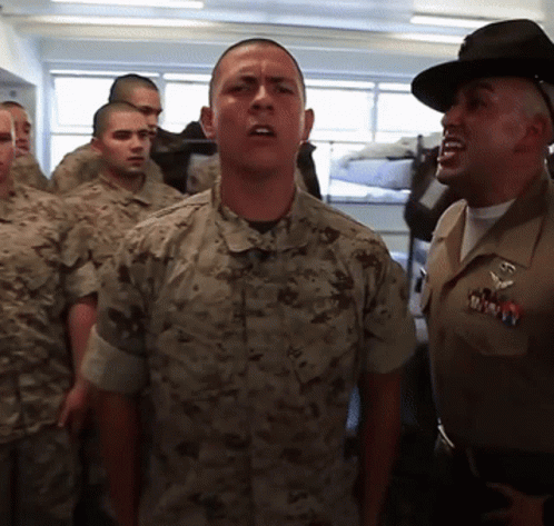 A Man In A Military Uniform Has A Badge That Says Marines On It GIF