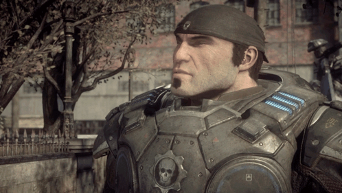 A Man In A Military Uniform Has A Gear With A Skull On It On His Chest GIF
