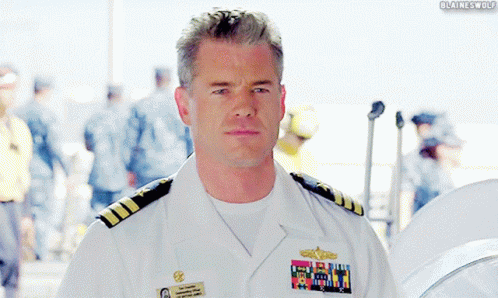A Man In A Military Uniform Has A Name Tag That Says ' Blaine Wolf ' GIF