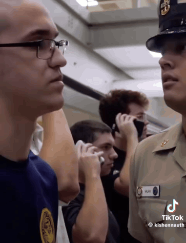 A Man In A Military Uniform Has A Name Tag That Says Kishennaugh On It GIF