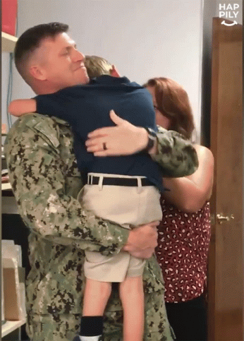 Man In Military Uniform Holding Child GIF