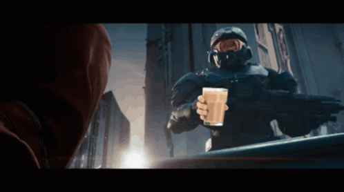 A Man In A Military Uniform Is Holding A Glass Of Milk GIF