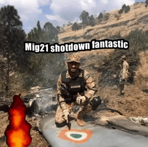 A Man In A Military Uniform Is Kneeling Next To A Plane With The Caption Mig21 Shot Down Fantastic GIF