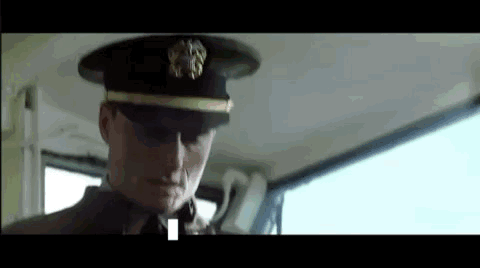 A Man In A Military Uniform Is Sitting In The Back Seat Of A Car . GIF