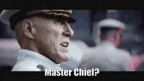 A Man In A Military Uniform Is Standing In Front Of A Crowd And Says Master Chief ? GIF