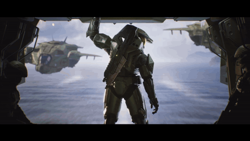 A Man In A Military Uniform Is Standing In Front Of A Window GIF