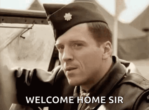 A Man In A Military Uniform Is Standing Next To A Car And Says Welcome Home Sir GIF