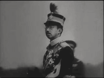 A Man In A Military Uniform Salutes In A Black And White Photo . GIF