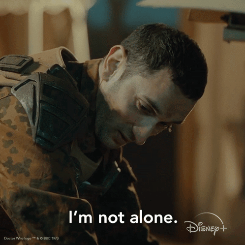 A Man In A Military Uniform Says " I 'M Not Alone " In A Disney + Ad GIF