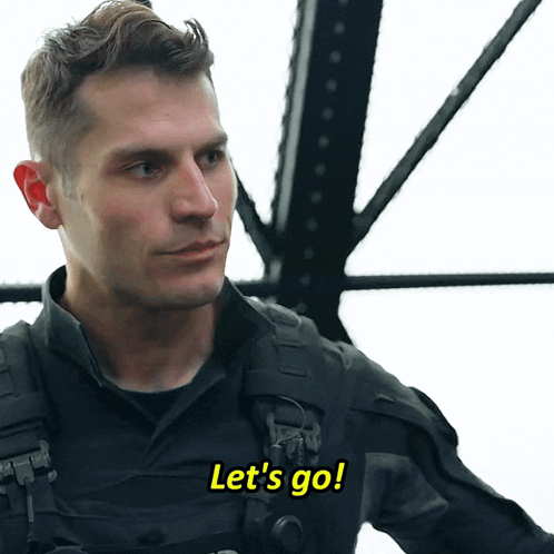 A Man In A Military Uniform Says Let 'S Go In Yellow Letters GIF