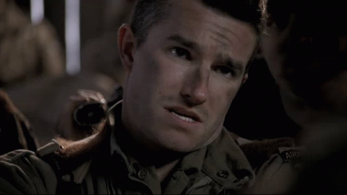 A Man In A Military Uniform Says " No Idea " In Front Of Another Man GIF