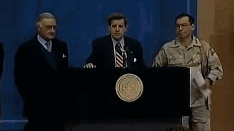 A Man In A Military Uniform Stands At A Podium GIF
