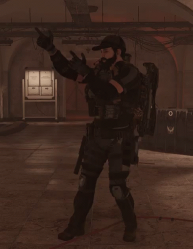 A Man In A Military Uniform Stands In A Dark Room Holding A Rifle GIF