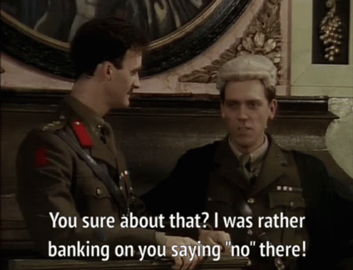 A Man In A Military Uniform Talks To Another Man In A Suit GIF