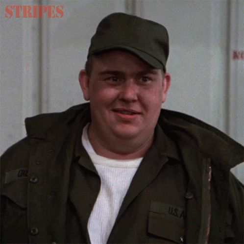 A Man In A Military Uniform With The Word Stripes On The Bottom Right GIF