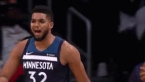 A Man In A Minnesota 32 Jersey Stands On The Court GIF