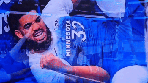 A Man In A Minnesota Jersey With The Number 32 On The Back GIF