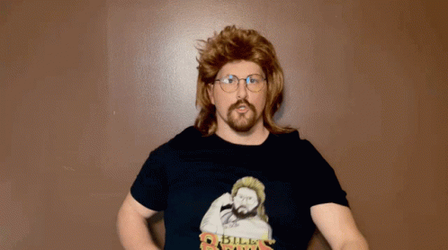 A Man In A Mullet And Glasses Is Wearing A Shirt That Says " Bill Riga " GIF