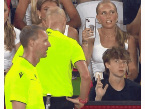 A Man In A Neon Yellow Shirt With The Word Macron On The Front GIF