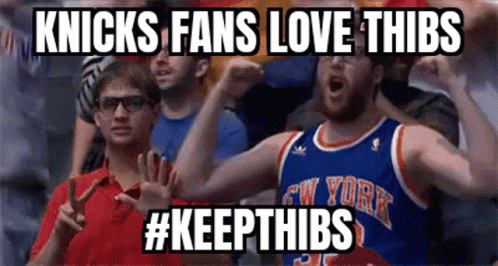 A Man In A New York Knicks Jersey Is Cheering GIF