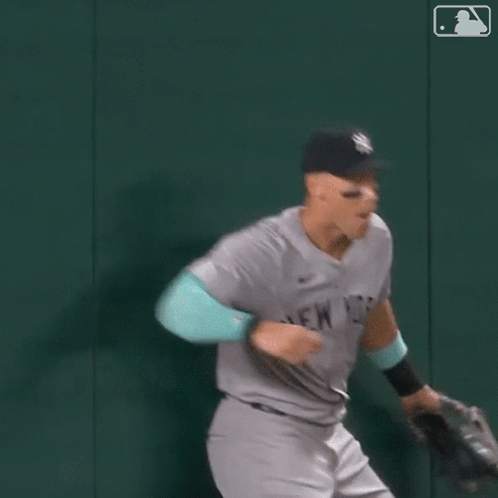 Man In Yankees Uniform Running GIF