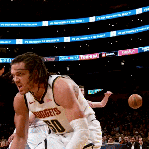 A Man In A Nuggets Jersey Dribbles A Ball GIF