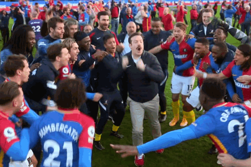 A Man In A Number 21 Jersey Is Surrounded By Other Soccer Players GIF