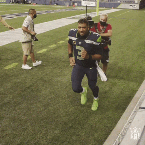 A Man In A Number 5 Jersey Is Running On A Field GIF
