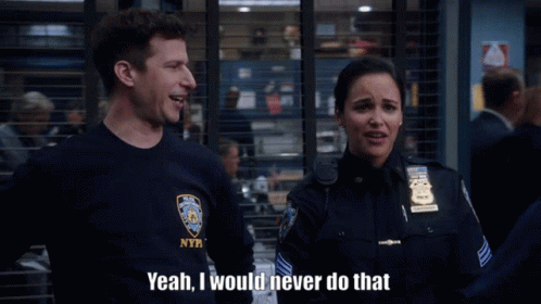 A Man In A Nypd Shirt Is Talking To A Woman GIF