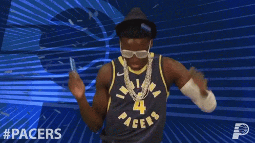 A Man In A Pacers Jersey Is Dancing With His Arms In The Air GIF