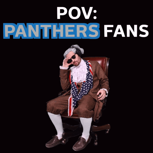 A Man In A Panthers Costume Sits In A Chair GIF