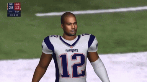A Man In A Patriots Jersey Is Standing On A Field GIF