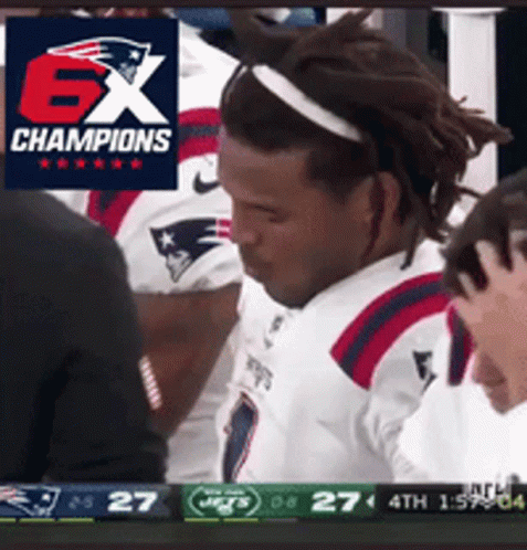 A Man In A Patriots Jersey Stands In Front Of A Screen That Says Ex Champions GIF