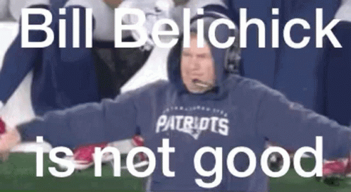 A Man In A Patriots Sweatshirt Is Standing On A Football Field . GIF