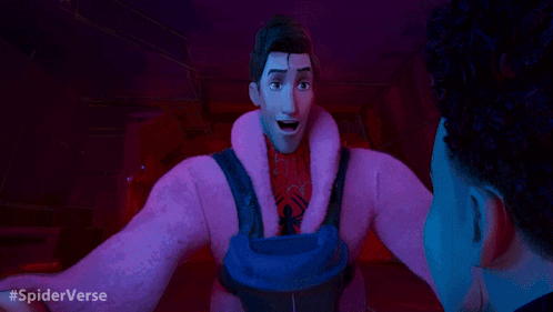 A Man In A Pink Coat Is Talking To Another Man In A Dark Room With #Spiderverse Written In The Corner GIF