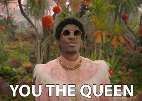 A Man In A Pink Feathered Outfit Says " You The Queen " GIF